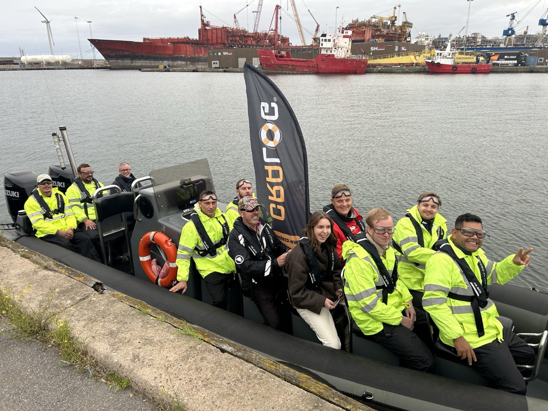 CRALOG service providers and staff together in a CRALOG-branded RIB at the harbour
